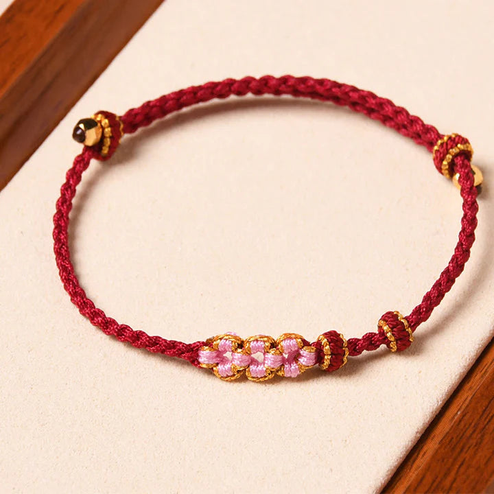 Pulseira Flor de Pêssego Trançada da Proteção