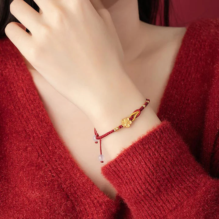 Pulseira Vermelha Flor de Cerejeira da Renovação
