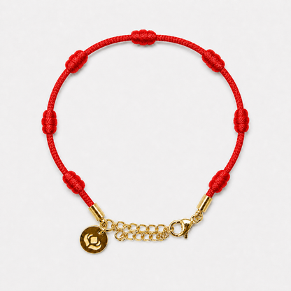 Pulseira Premium dos 7 Nós vermelha com dourado