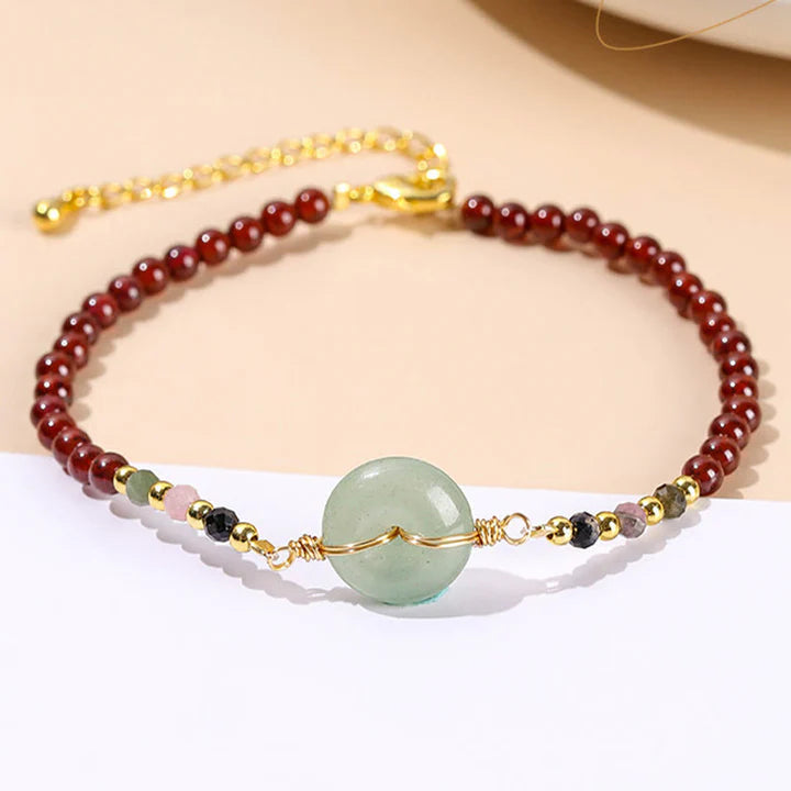 Pulseira Roda da Proteção em Granada Natural