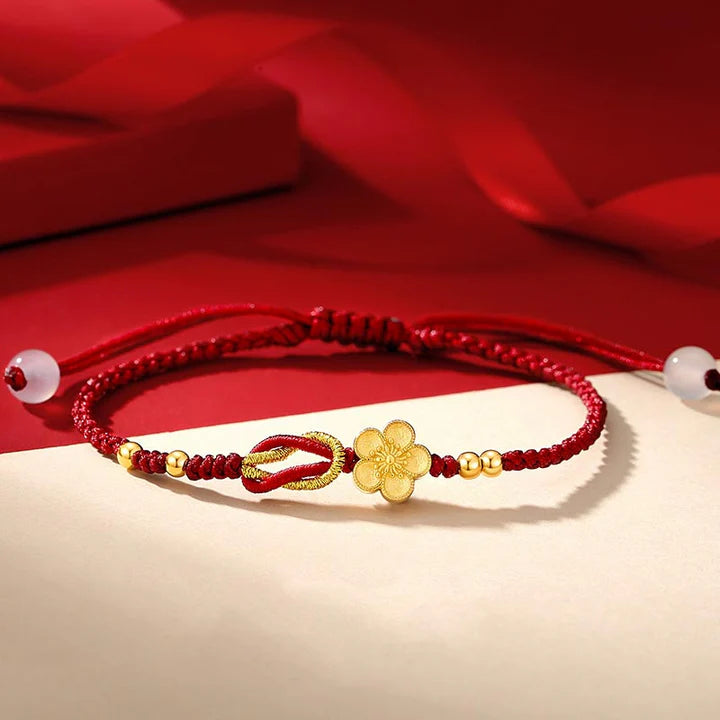 Pulseira Vermelha Flor de Cerejeira da Renovação