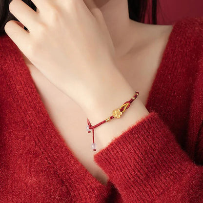 Pulseira Vermelha Flor de Cerejeira da Renovação