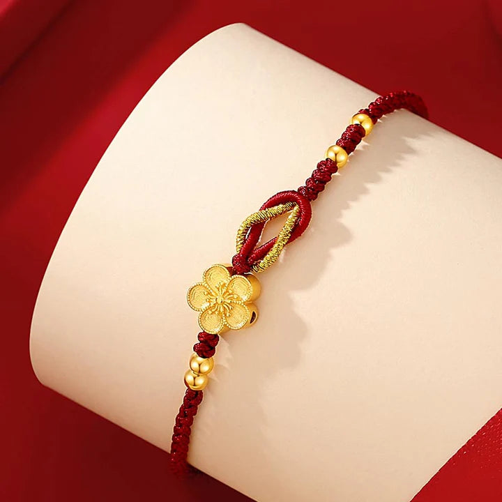 Pulseira Vermelha Flor de Cerejeira da Renovação