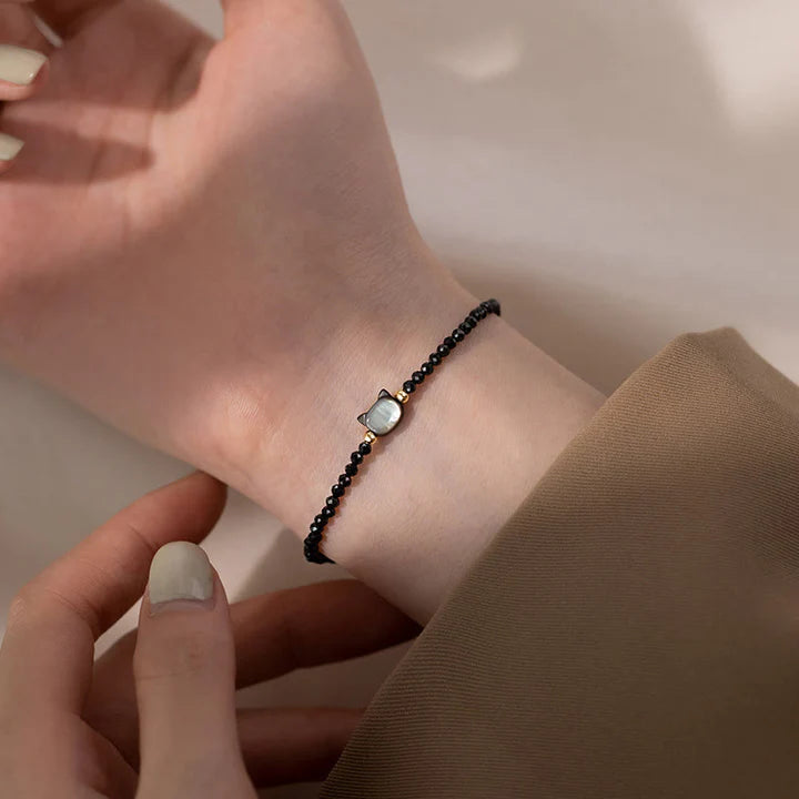 Pulseira Gato da Cura — no pulso