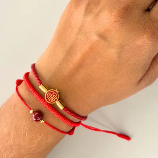 Pulseira Vermelha da Concentração — no pulso
