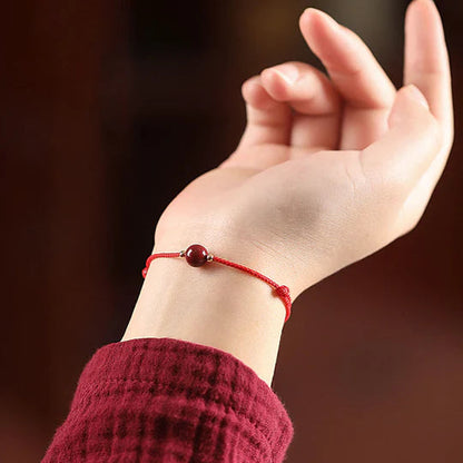 Pulseira Vermelha da Concentração — no pulso