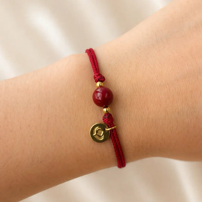 Pulseira Vermelha da Concentração — no pulso